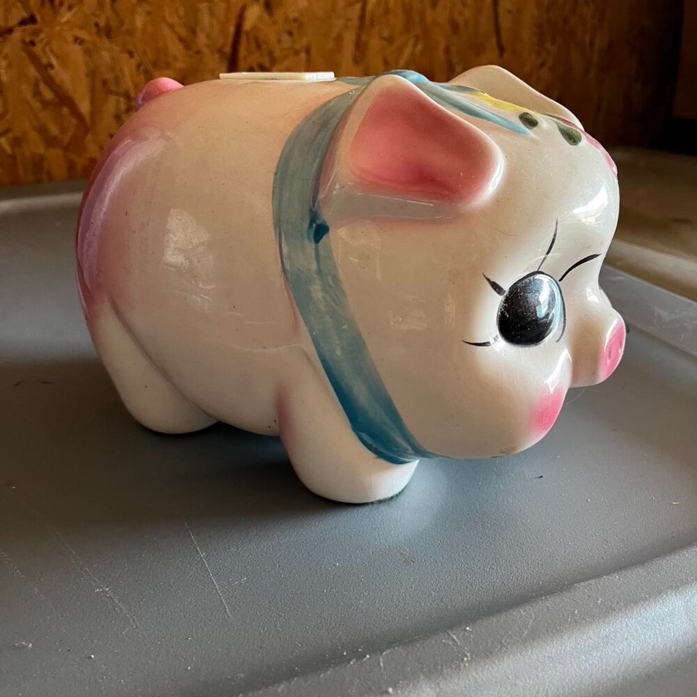 Vintage ceramic piggy bank with floral details